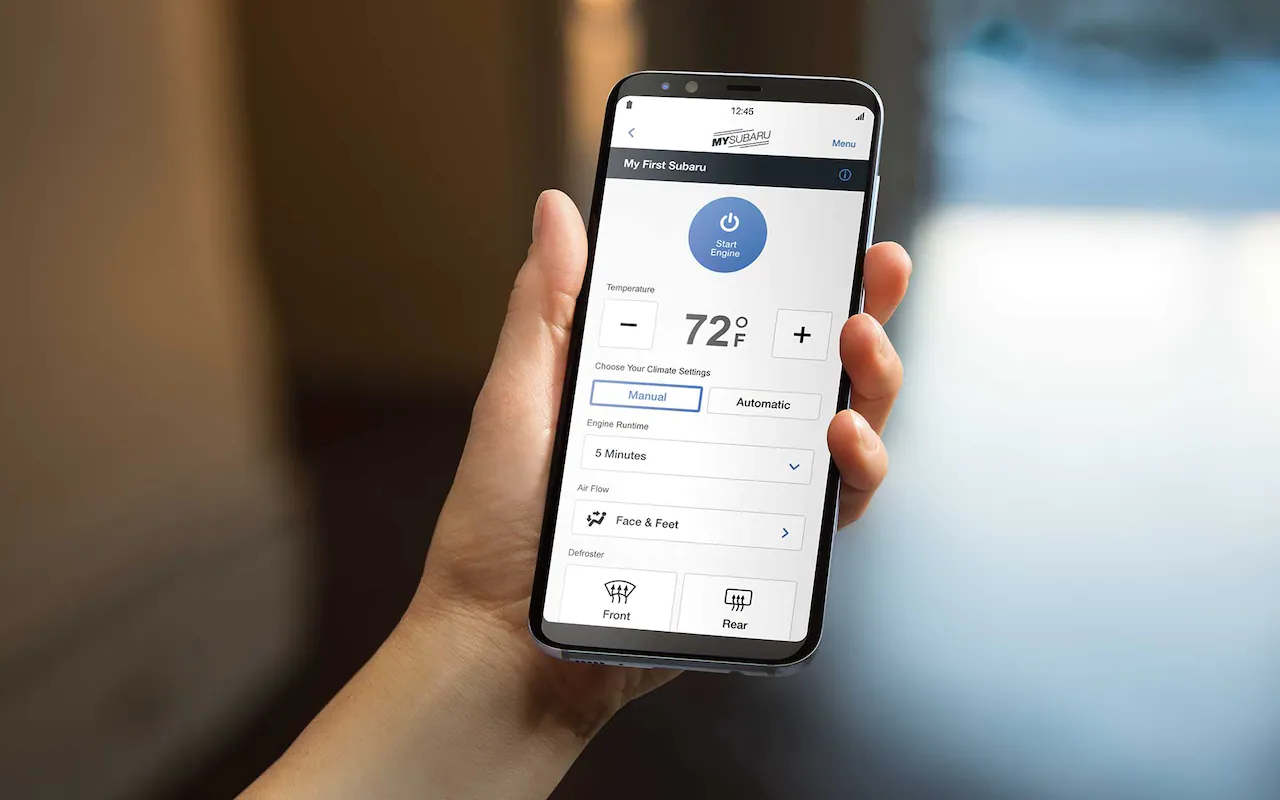 A smartphone showing the Remote Engine Start with Climate Control feature of SUBARU STARLINK® Safety and Security.
